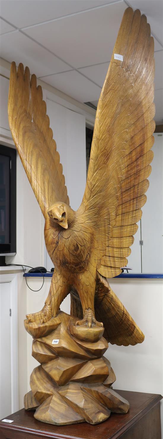 A large carved wood model of an eagle, H.190cms
